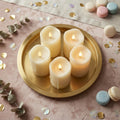 Five ivory LED pillar candles